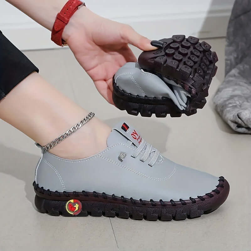 Ayla® ultra soft orthopedic shoes in gray, showcasing their flexible design and shock-absorbing sole, perfect for all foot types.